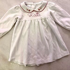 Soft, knit top or dress with embroidered floral collar and “kate” monogram